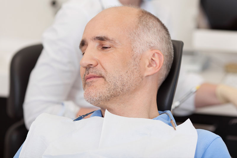 When Getting Treated With Full Mouth Dental Implants, Should You Have IV Sedation In St. Louis, MO?